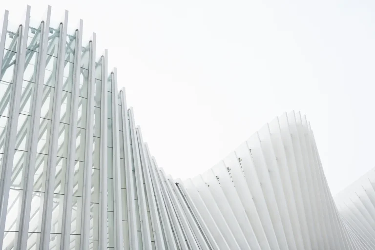 horizontal-shot-abstract-buildings-with-white-metallic-ribs-glass-windows